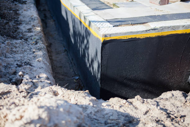 Professional Emergency Waterproofing technician working in Lawrenceburg, IN
